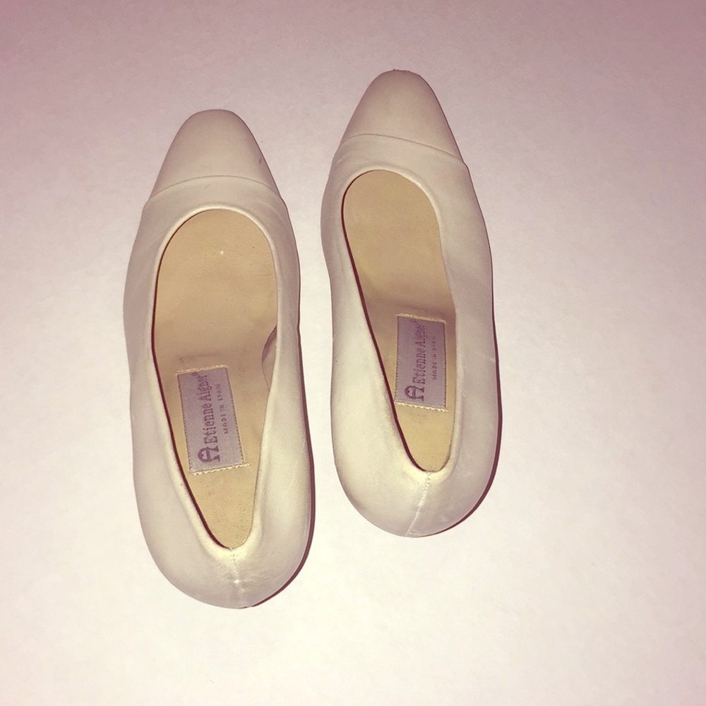 A Etienne is Aigner women high heel shoe.
